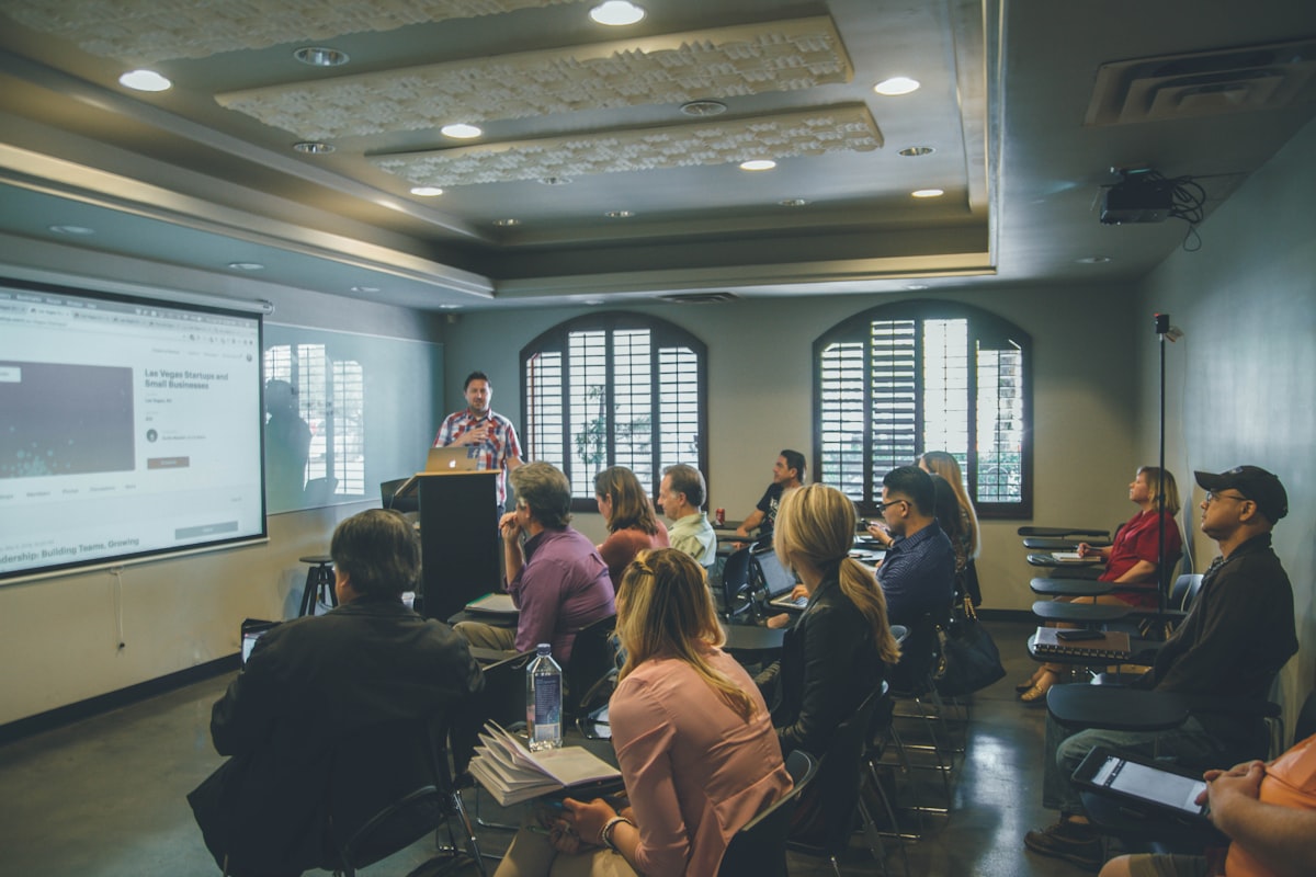 Professionals in a training session watching a presentation