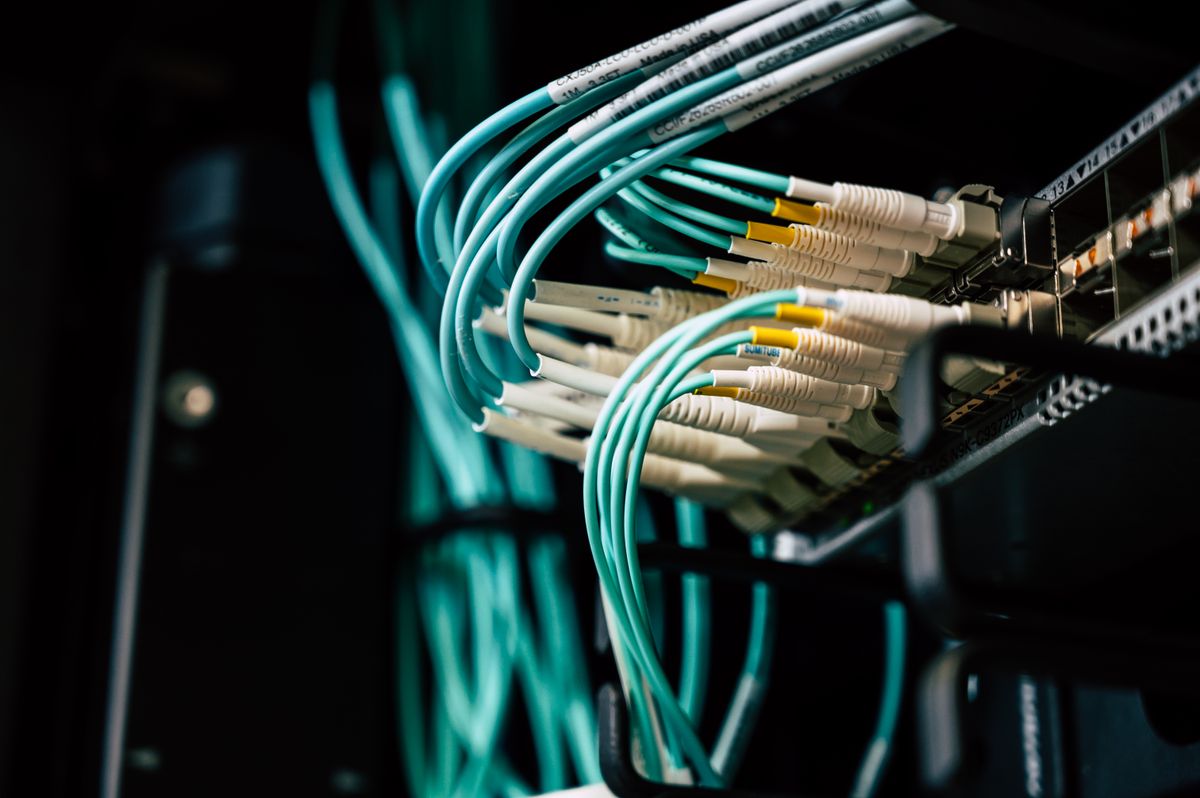 Fiber optic patch cables connected in a telecommunications panel